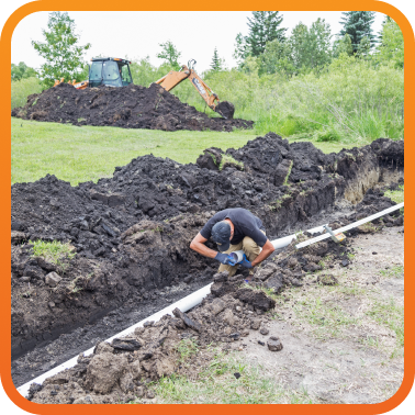 plumbing tech working on excavation